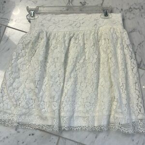 Lace 15 inch lined skirt. Elastic back band.